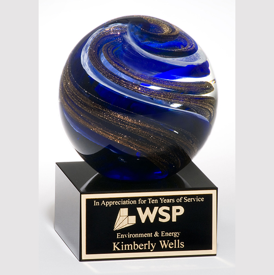 art glass with swirling blue and gold globe on black base with standard engraving