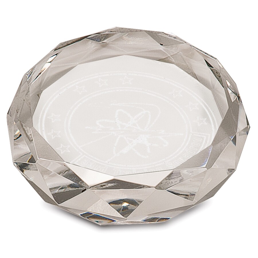 round, faceted crystal paperweight