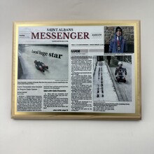 Newsprint article is embedded into metal