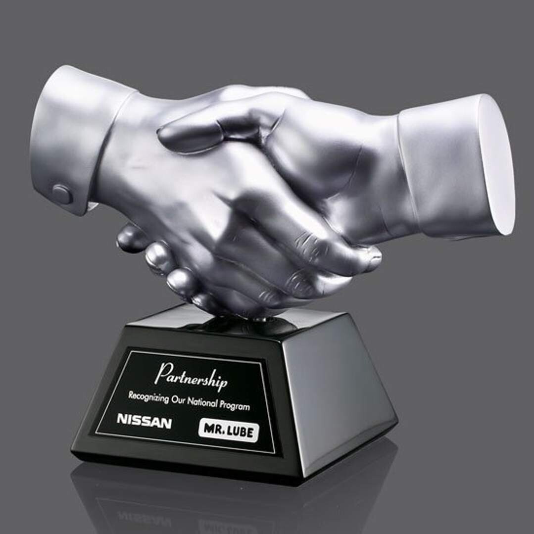Shaking Hands In Gold Or Silver On Black Resin Base