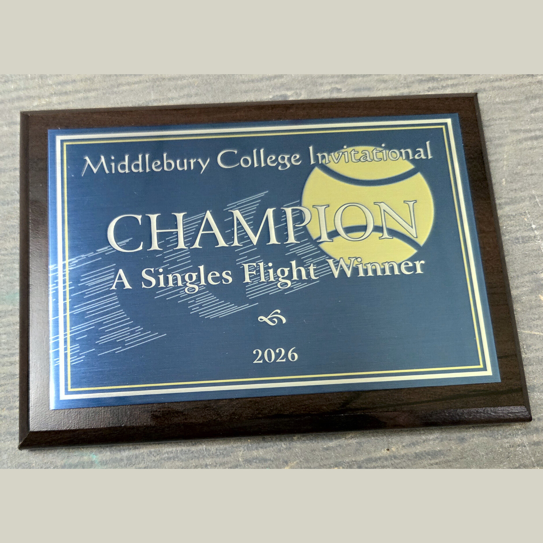 Vinyl plaque with silver aluminum, University of Vermont Medical Center logo, green border and name with award text in black